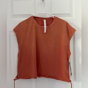 Women’s Stori rust orange workout tank. Size 10. New with tags. Never been worn